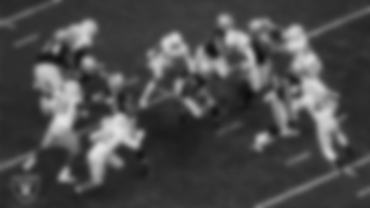 Las Vegas Raiders running back Josh Jacobs (28) rushes during the regular season home game against the Los Angeles Chargers at Allegiant Stadium.