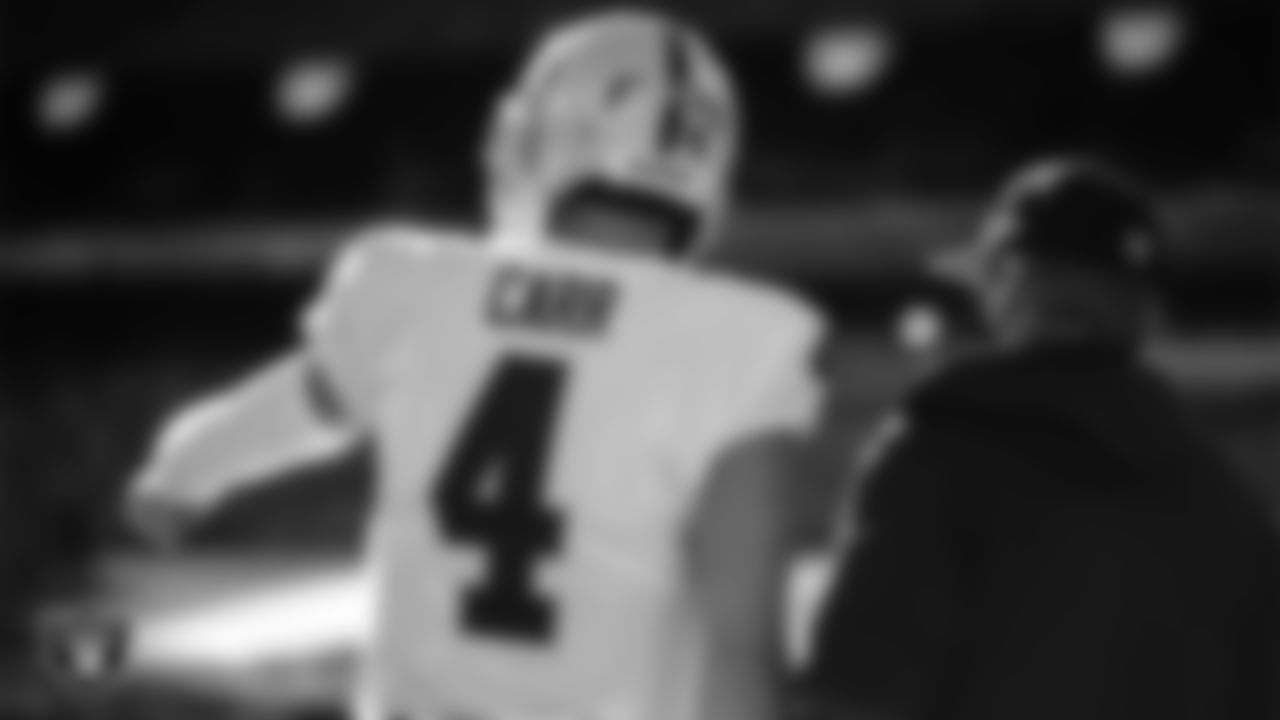 Las Vegas Raiders quarterback Derek Carr (4) and Head Coach Jon Gruden before the regular season away game against the New York Jets.