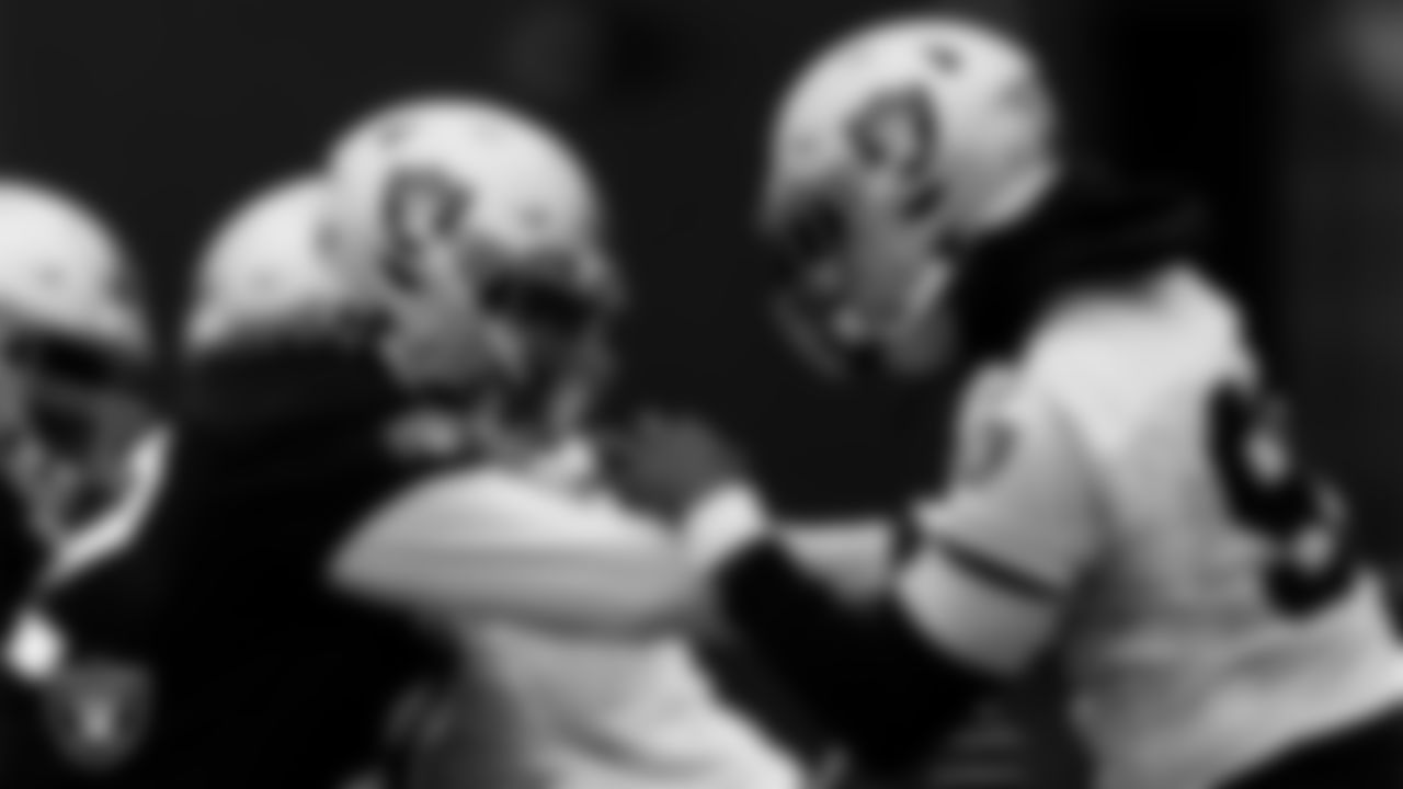 Las Vegas Raiders offensive lineman Jaryd Jones-Smith (72) and defensive end Arden Key (99) during practice at Intermountain Healthcare Performance Center.