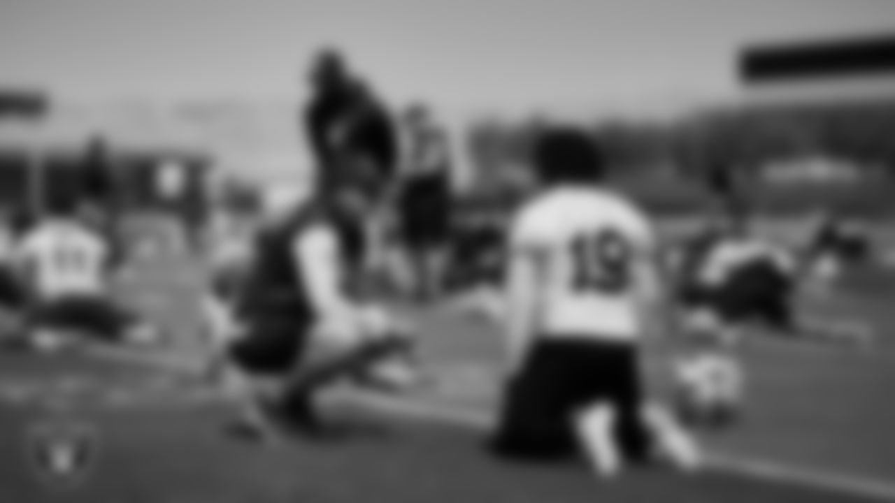 Las Vegas Raiders offensive quality control coach Mitch Singler and wide receiver DJ Turner (19) at an Organized Team Activity (OTA).