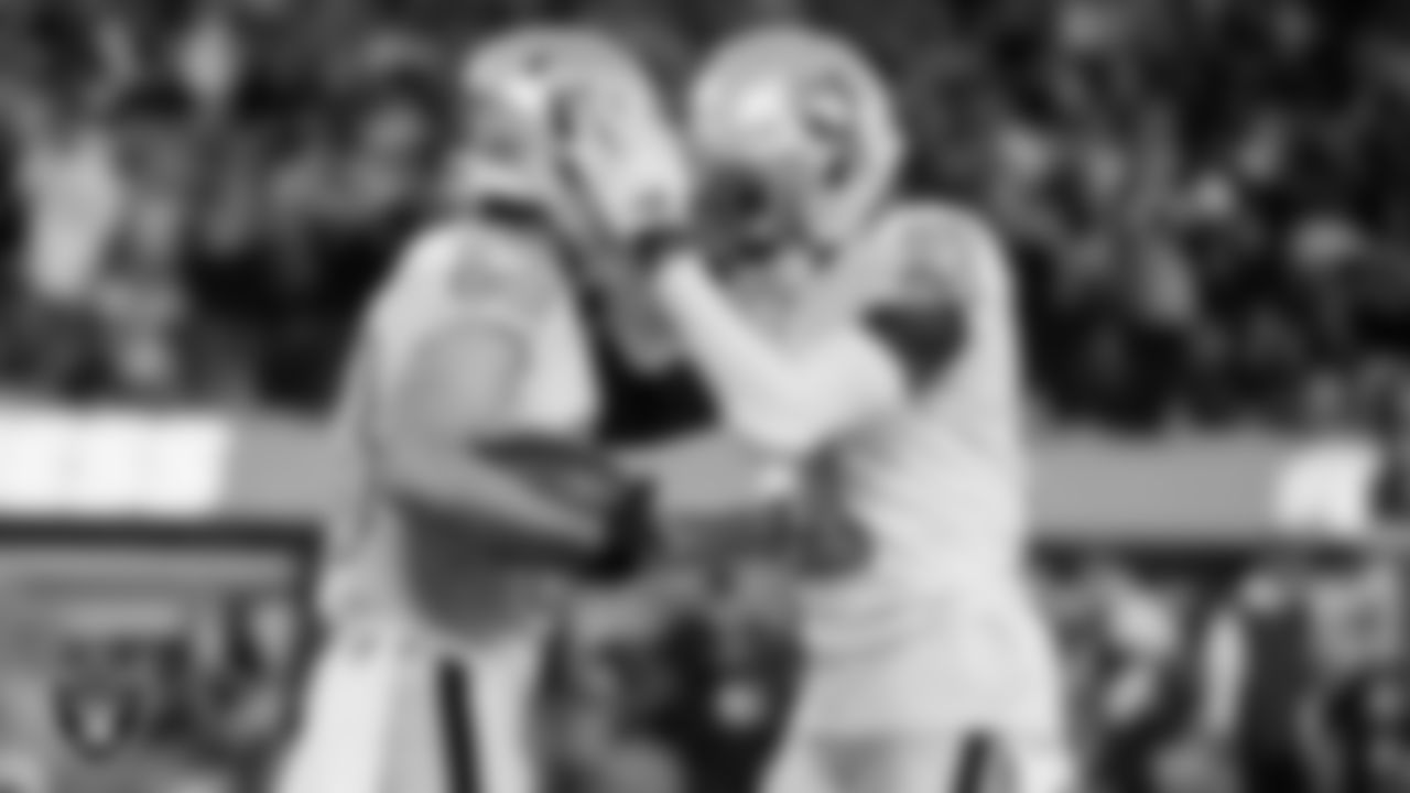 Las Vegas Raiders wide receiver Hunter Renfrow (13) is congratulated by wide receiver Henry Ruggs III (11) after making a 10-yard touchdown catch during the regular season away game against the Los Angeles Chargers.