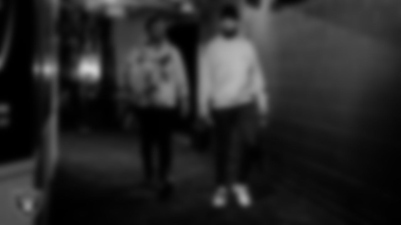 Las Vegas Raiders offensive lineman Hroniss Grasu (65) and quarterback Marcus Mariota (8) arrive to the regular season home game against the Los Angeles Chargers.