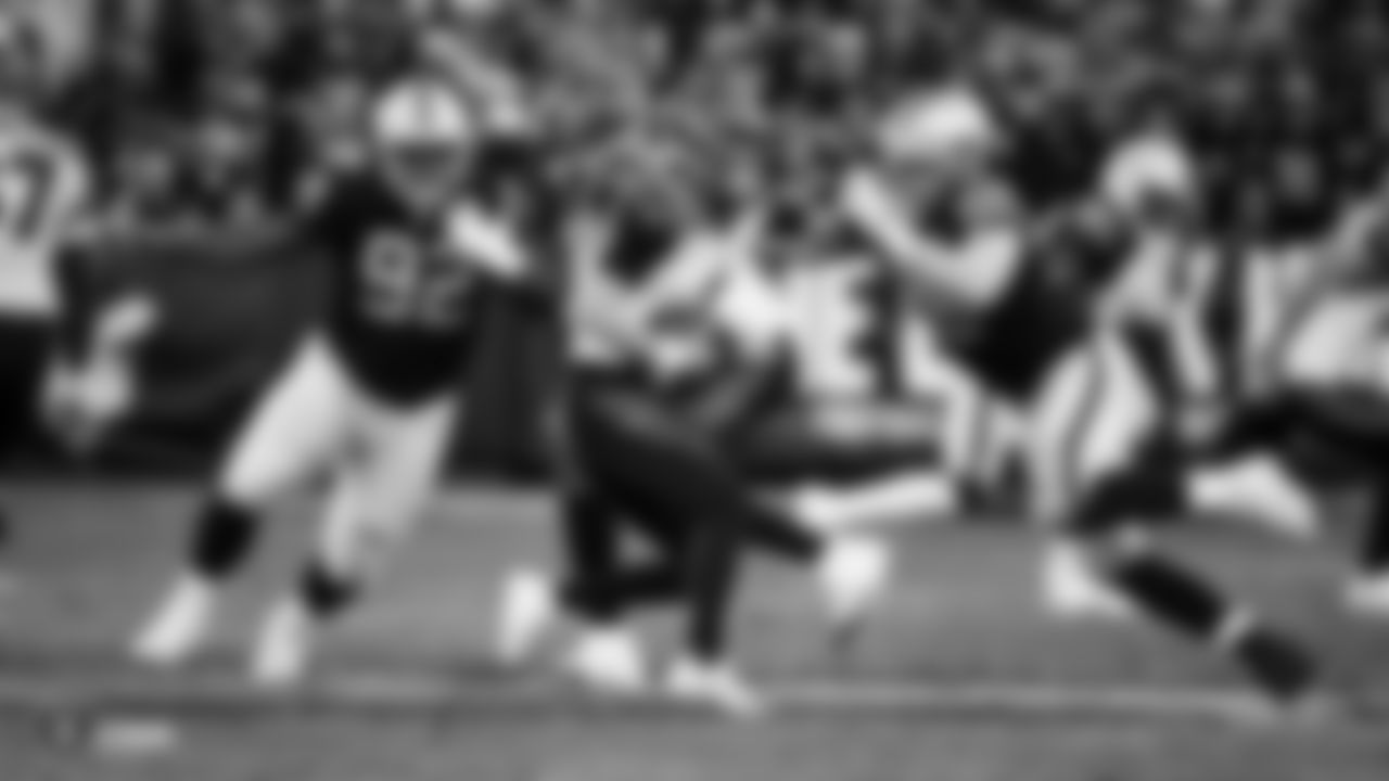 Raiders defensive end Maxx Crosby (98) sacks the quarterback during the regular season game against the Cincinnati Bengals.