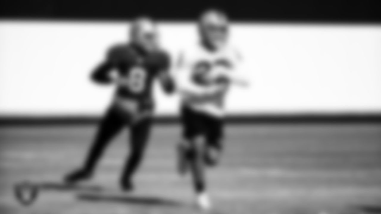 Las Vegas Raiders quarterback Marcus Mariota (8) and running back Devontae Booker (23) during practice.