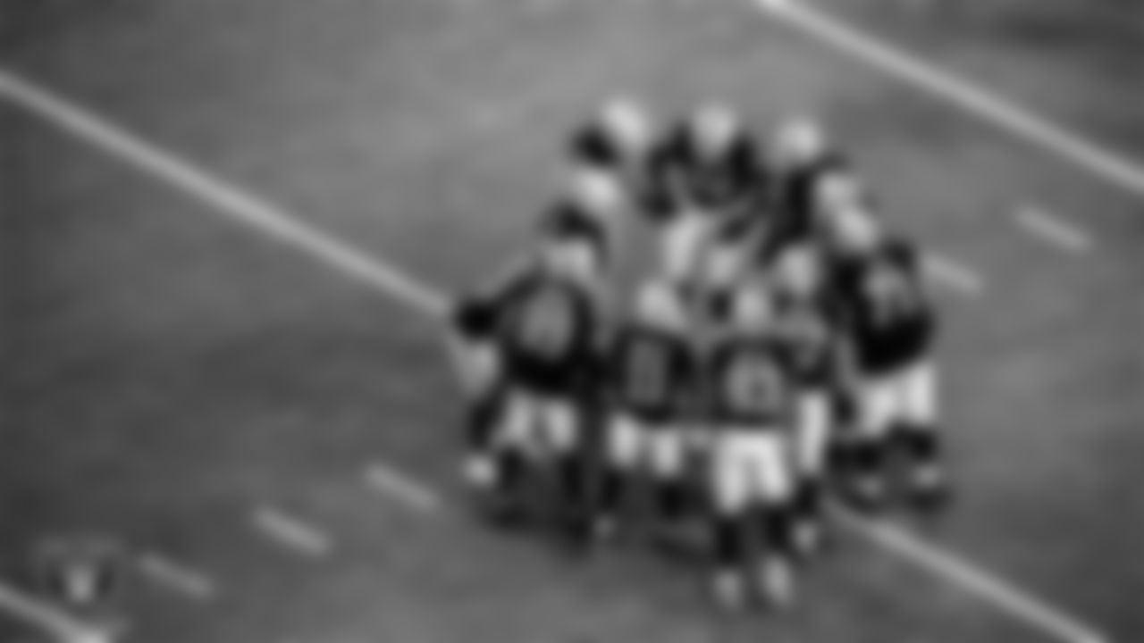 The Las Vegas Raiders huddle up during the regular season home game against the New Orleans Saints.
