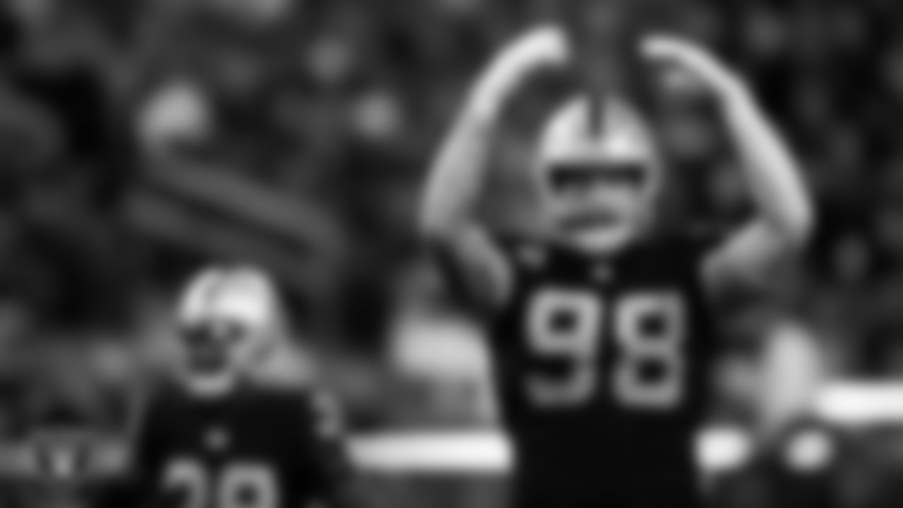 Las Vegas Raiders defensive end Maxx Crosby (98) pumps the crowd up during the regular season home game against the Washington Football Team.