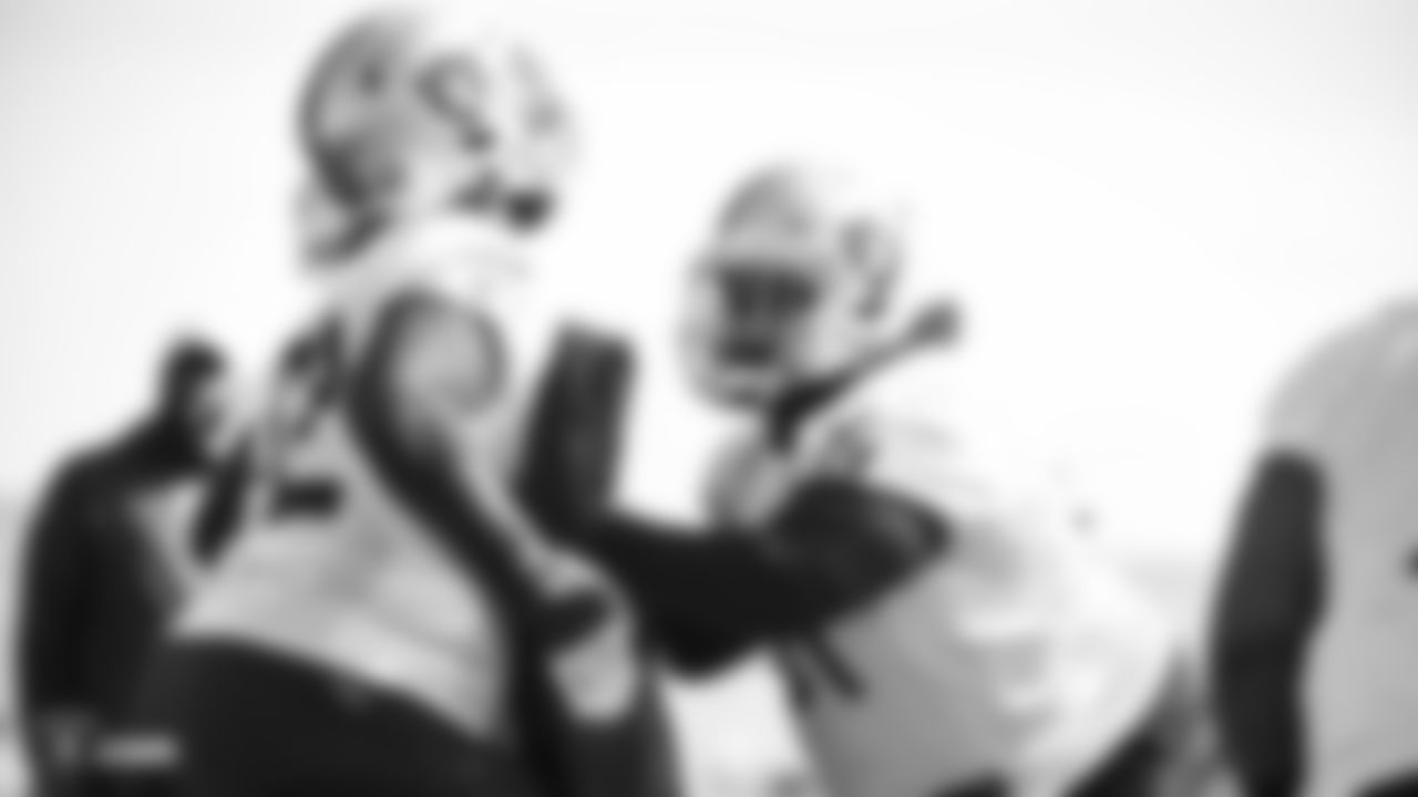 Raiders tackle David Sharpe (72) and center Rodney Hudson (61) go through offensive drills during practice.