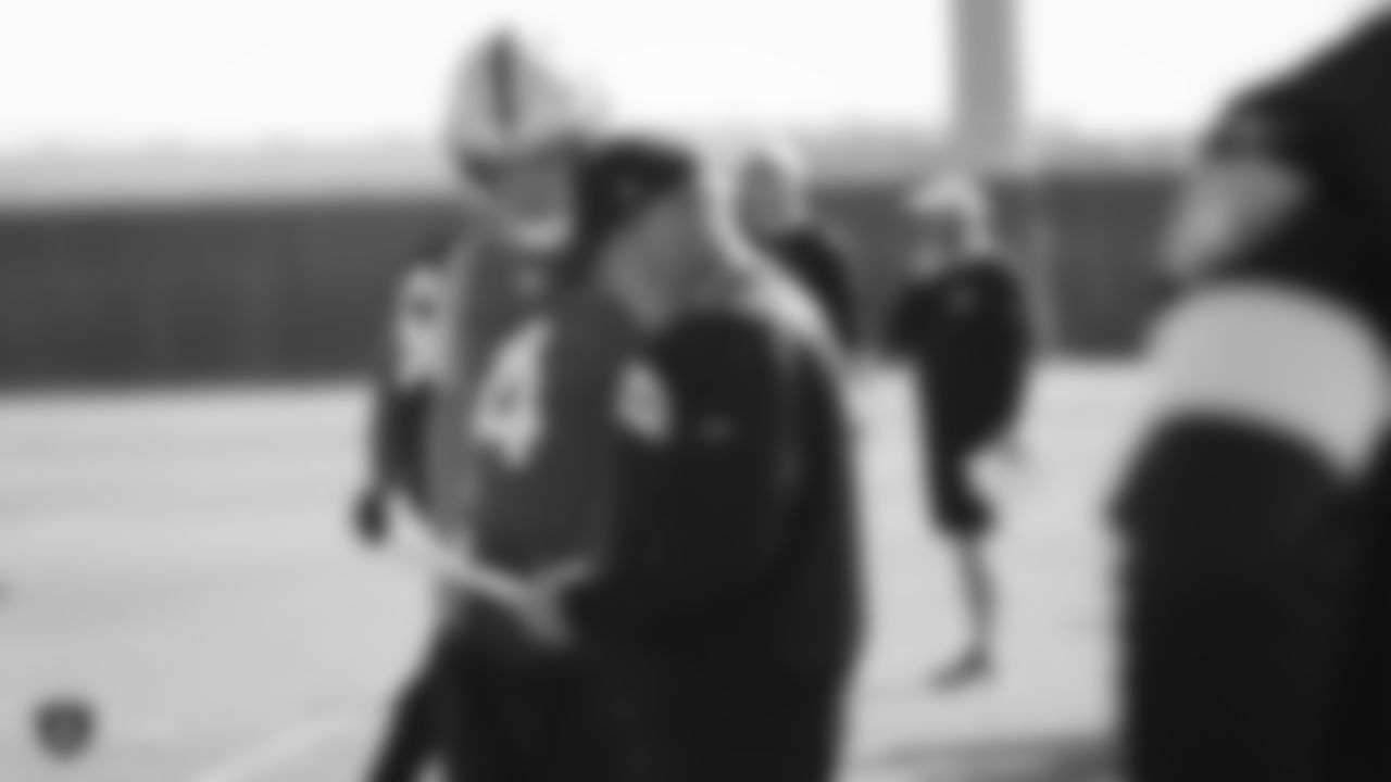 Oakland Raiders quarterback Derek Carr (4) talks with Head Coach Jon Gruden during practice.