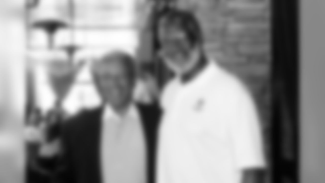 President of the Pro Football Hall of Fame Steve Perry and Bobby Bell pose for a photo.