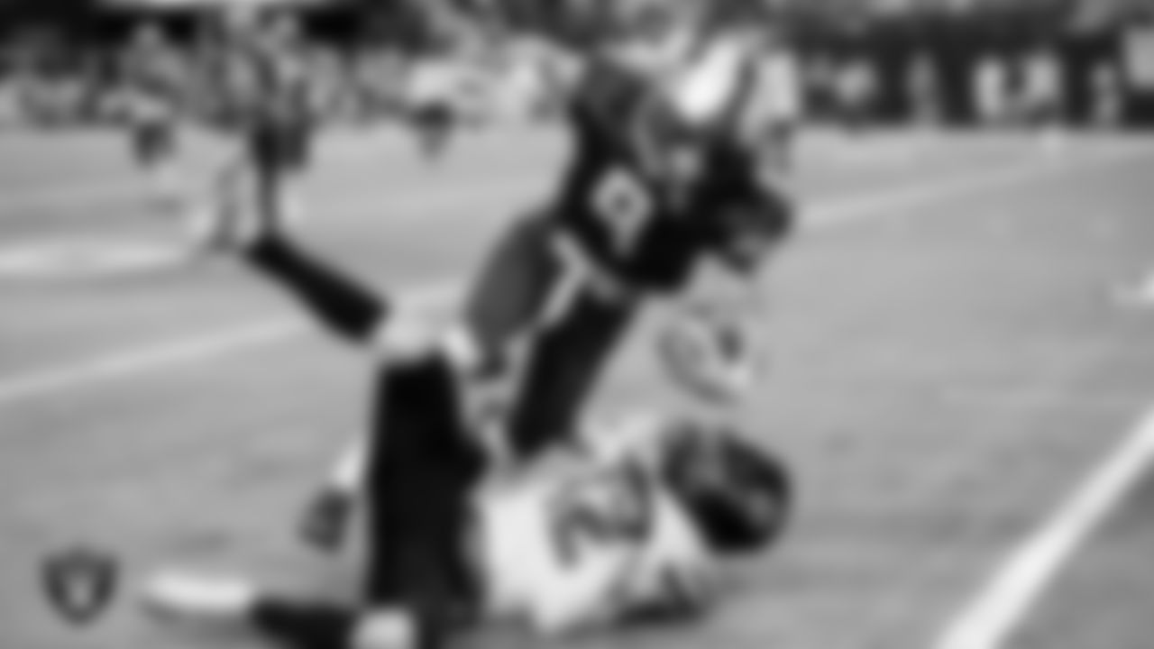 A Moapa Valley High School player is brought down by a Virgin Valley High School player during the NIAA Class 3A State Football Championship at Allegiant Stadium.
