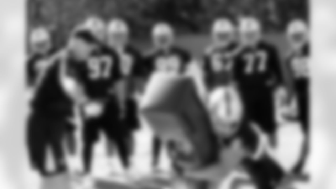 The defensive linemen work on their tackling techniques. Photo by Tony Gonzales.