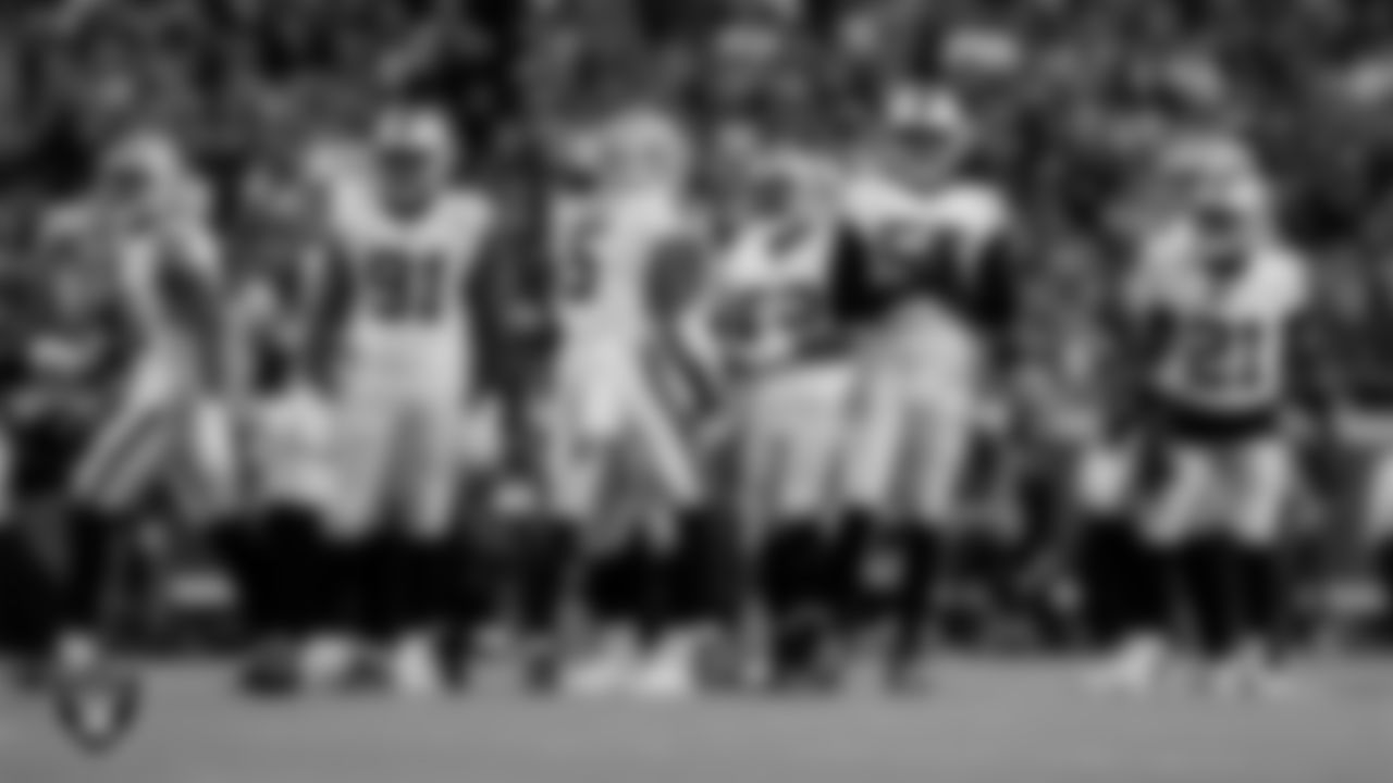 The Las Vegas Raiders defense huddles during the regular season away game against the Kansas City Chiefs at GEHA Field at Arrowhead Stadium.