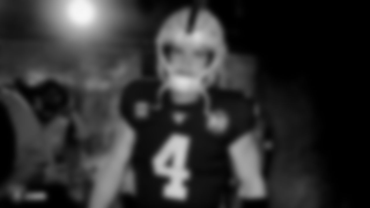 Raiders quarterback Derek Carr (4) walks down the tunnel before the regular season game against the Denver Broncos.