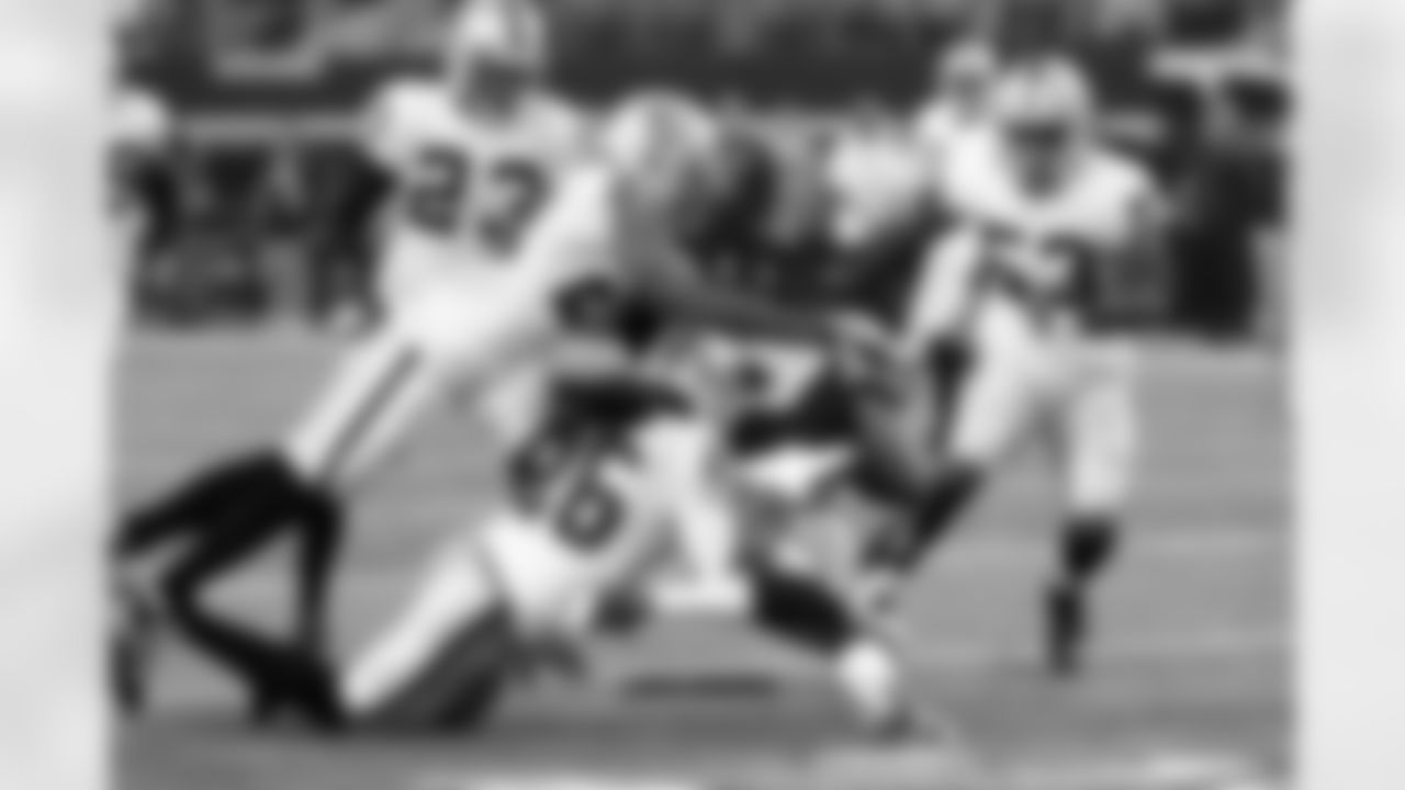 S Usama Young, with the help of CB Phillip Adams, brings down the ball carrier.