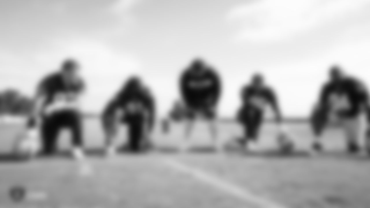 Raiders defensive line coach Brentson Buckner talks with defensive end Josh Mauro (97), defensive end Benson Mayowa (91), defensive end Clelin Ferrell (96) and defensive tackle Corey Liuget (94) during practice at the Raiders Practice Facility.