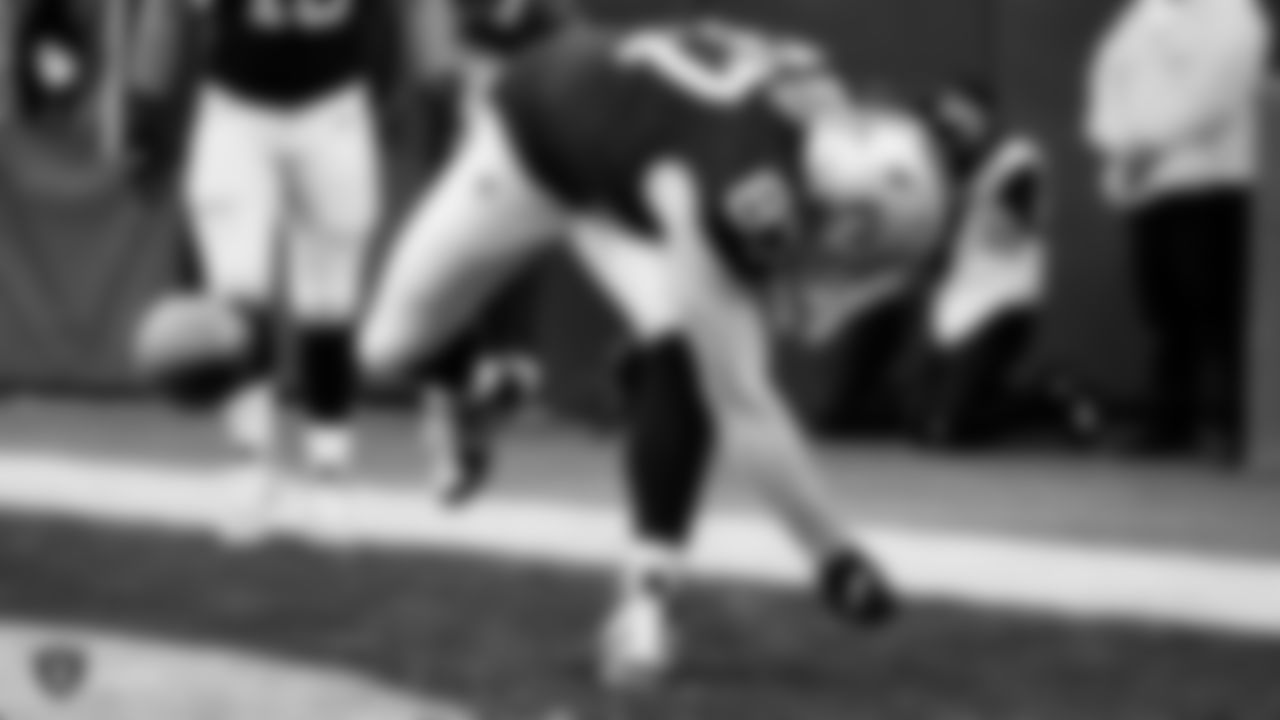 Raiders tight end Foster Moreau (87) celebrates after a 1-yard touchdown catch during the regular season game against the Tennessee Titans.