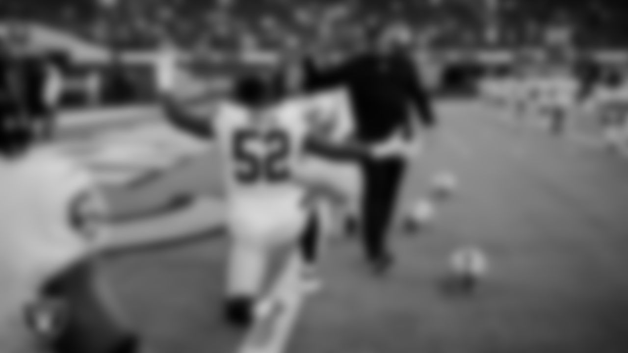 Las Vegas Raiders defensive end Gerri Green (52) and Head Coach Jon Gruden before the preseason game against the Los Angeles Rams at SoFi Stadium.