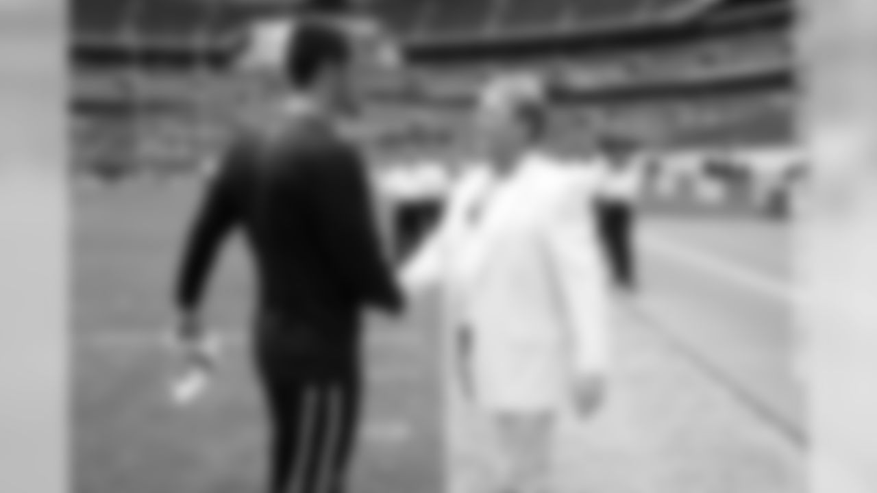QB Derek Carr comes over to say hello to owner Mark Davis.