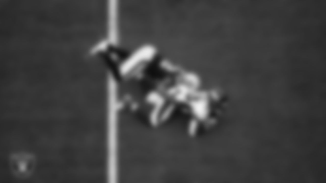 Las Vegas Raiders linebacker Denzel Perryman (52) makes a tackle during the regular season home game against the Denver Broncos at Allegiant Stadium.