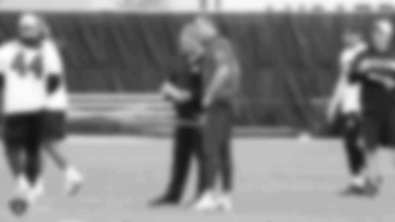 Raiders head coach Jon Gruden and quarterback Derek Carr (4) at a workout during phase two of the offseason program at the Raiders Practice Facility in Alameda, Calif.