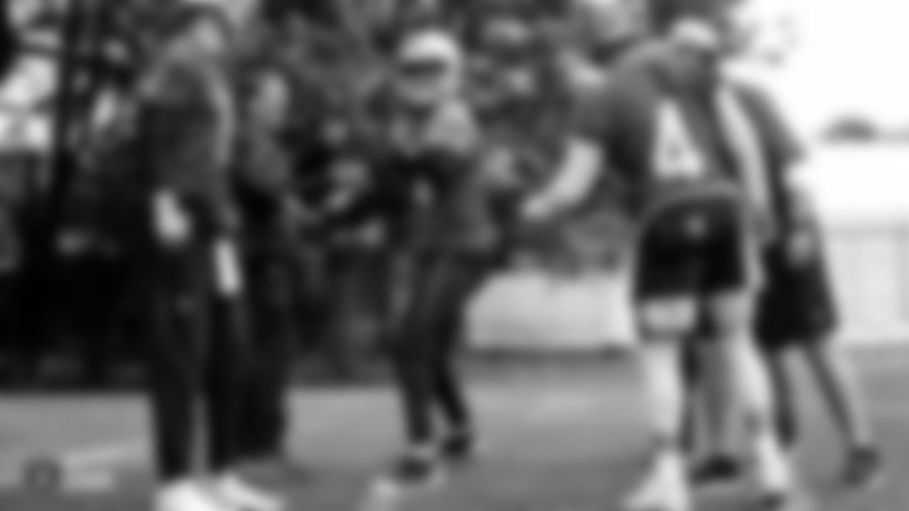 Raiders quarterback DeShone Kizer (14), quarterback Mike Glennon (7), offensive coordinator Greg Olson and quarterback Derek Carr (4) on the field for practice at The Grove Hotel.