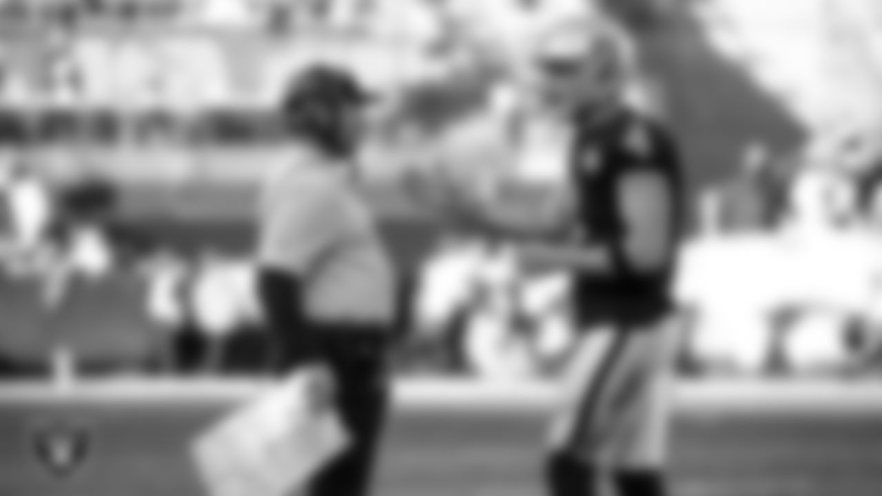 Raiders Head Coach Jon Gruden and quarterback Derek Carr (4) during a game in 2019.