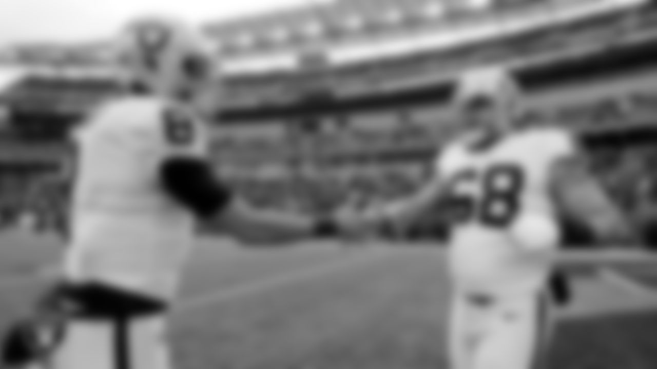 Las Vegas Raiders quarterback Marcus Mariota (8) and center Andre James (68) warming up before the postseason away game against the Cincinnati Bengals.