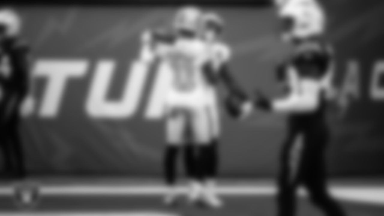 Las Vegas Raiders wide receiver Nelson Agholor (15) celebrates with wide receiver Henry Ruggs III (11) after making a 45-yard touchdown catch during the regular season away game against the Los Angeles Chargers.