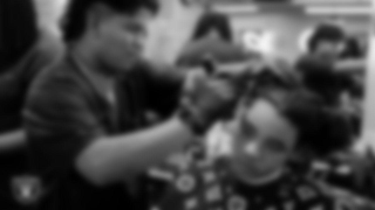 Students receive free haircuts and beautician services for the back to school season courtesy of the Las Vegas Raiders at Expertise Cosmetology Institute.