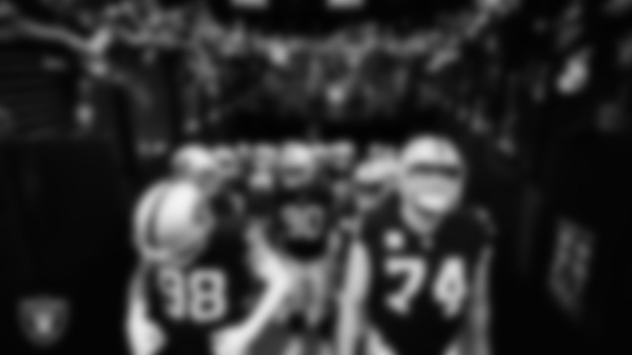 The Las Vegas Raiders wait to be introduced onto the field before the regular season home game against the New England Patriots at Allegiant Stadium.
