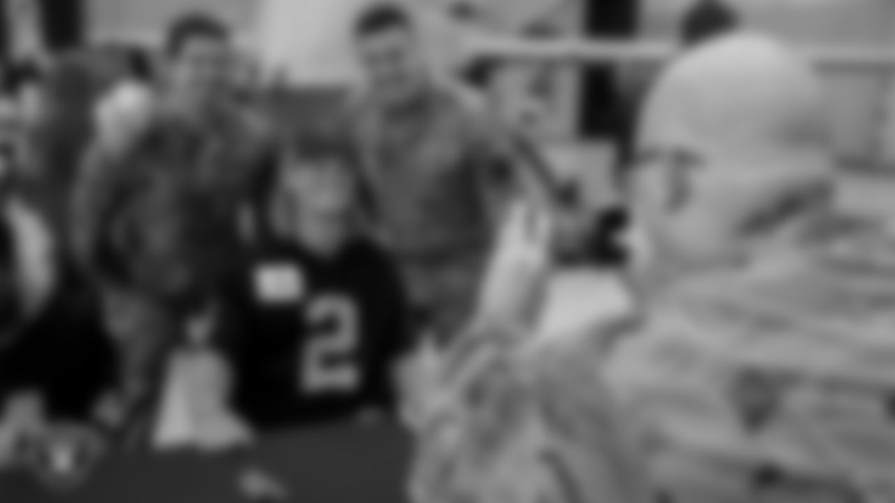 Las Vegas Raiders kicker Daniel Carlson (2) poses for a photo with Air Force members from Creech Air Force Base.