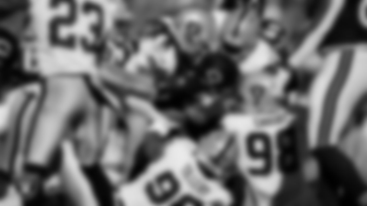 Las Vegas Raiders safety Tre'von Moehrig (25), defensive lineman Jerry Tillery Jr. (90), defensive end Maxx Crosby (98) and defensive tackle Bilal Nichols (91) during the regular season away game against the Chicago Bears at Soldier Field.