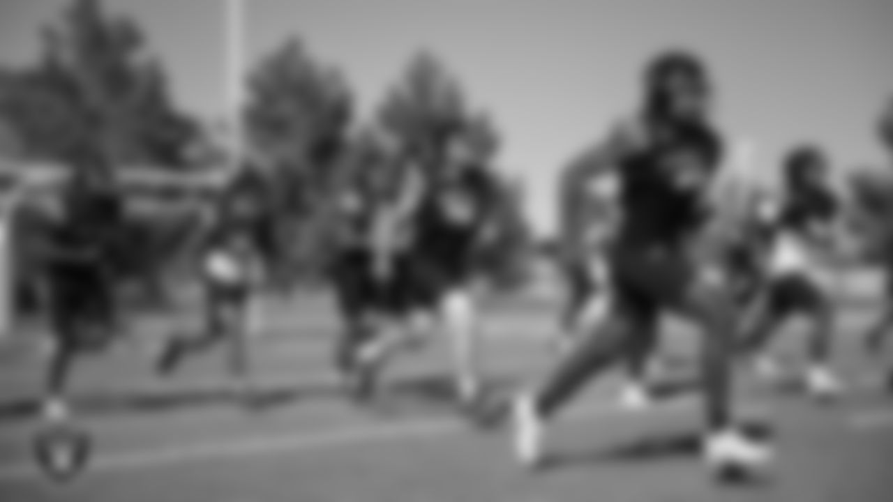 Members of the Desert Pines High School football team go through a drill during practice at Desert Pines High School.