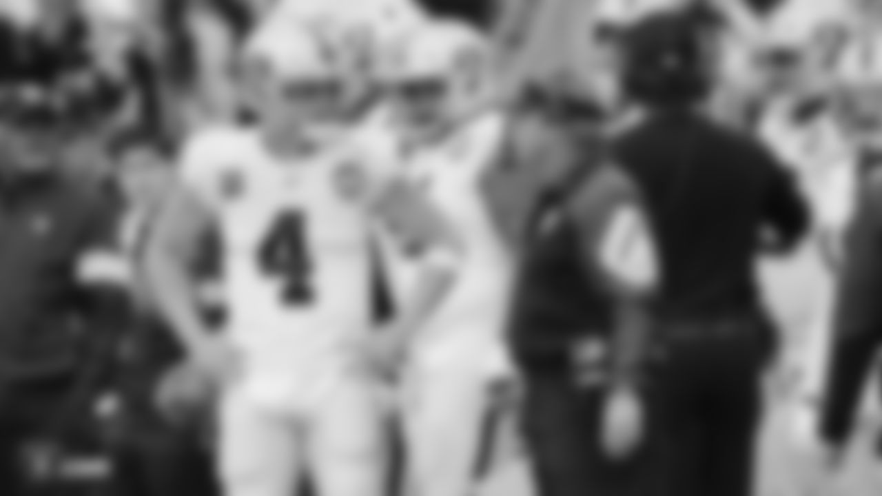 Raiders quarterback Derek Carr (4) talks with Head Coach Jon Gruden during the regular season game against the Los Angeles Chargers.