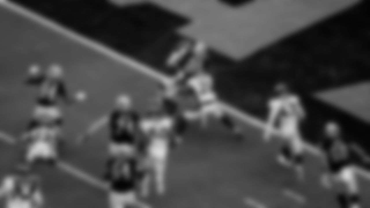 Las Vegas Raiders running back Josh Jacobs (28) rushes for a 10-yard touchdown during the regular season home game against the Denver Broncos at Allegiant Stadium.