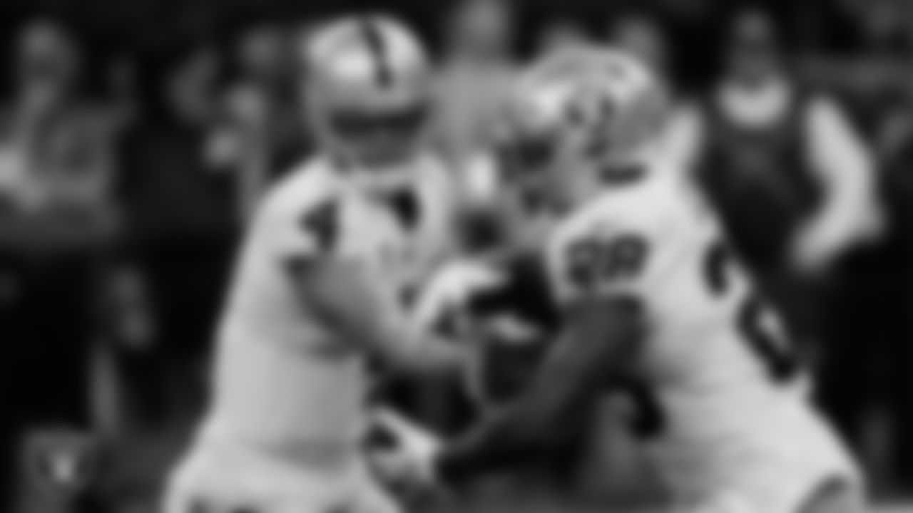 Las Vegas Raiders quarterback Derek Carr (4) hands the ball off to running back Josh Jacobs (28) during the regular season away game against the New Orleans Saints at Caesars Superdome.