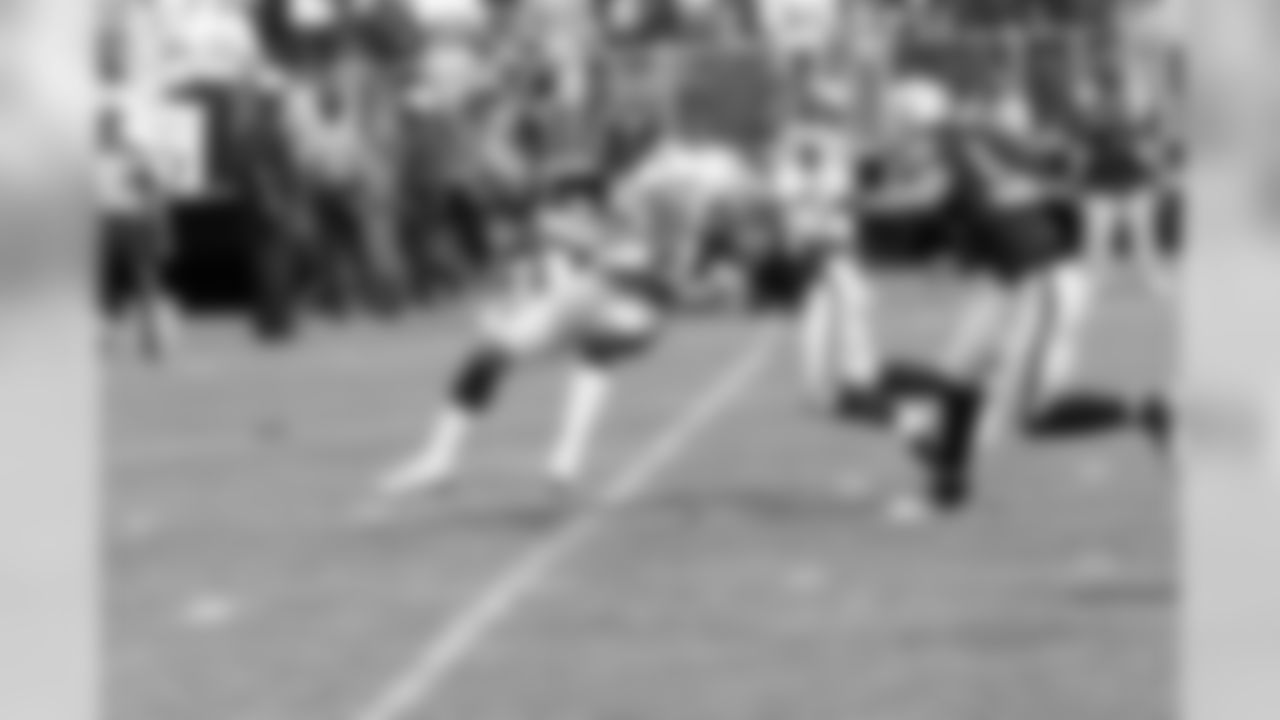 S Matt Giordano stops up WR Mike Wallace.