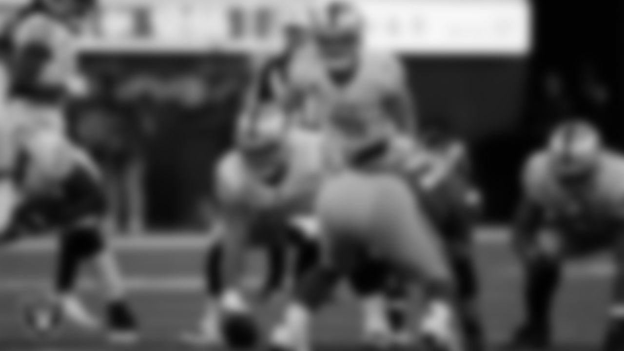 Las Vegas Raiders center Andre James (68) and quarterback Derek Carr (4) line up before the snap during the regular season away game against the Los Angeles Rams at SoFi Stadium.