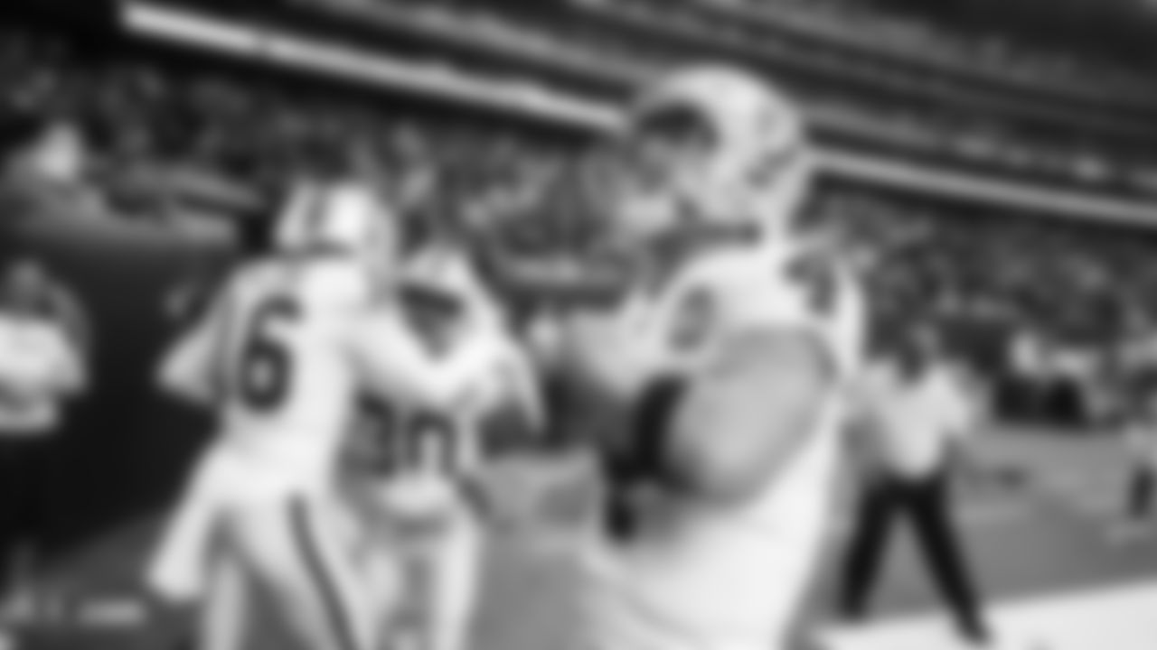 Raiders quarterback Derek Carr (4) celebrates after wide receiver Tyrell Williams' (16) 46-yard touchdown reception during the regular season game against the Houston Texans.