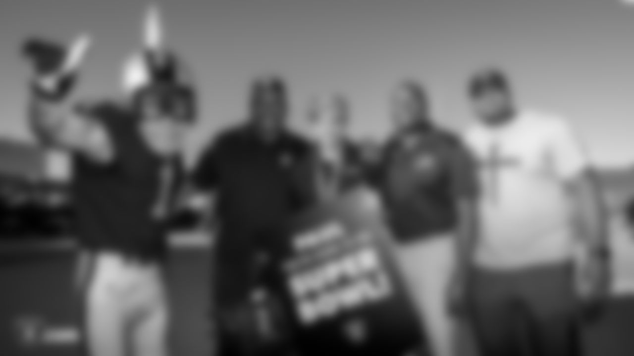 Raiders alumni James Harris, Rod Coleman and Raider Rusher surprise a fan with tickets to Super Bowl LIV at a Raiders Official Watch Party during the regular season game against the Cincinnati Bengals.