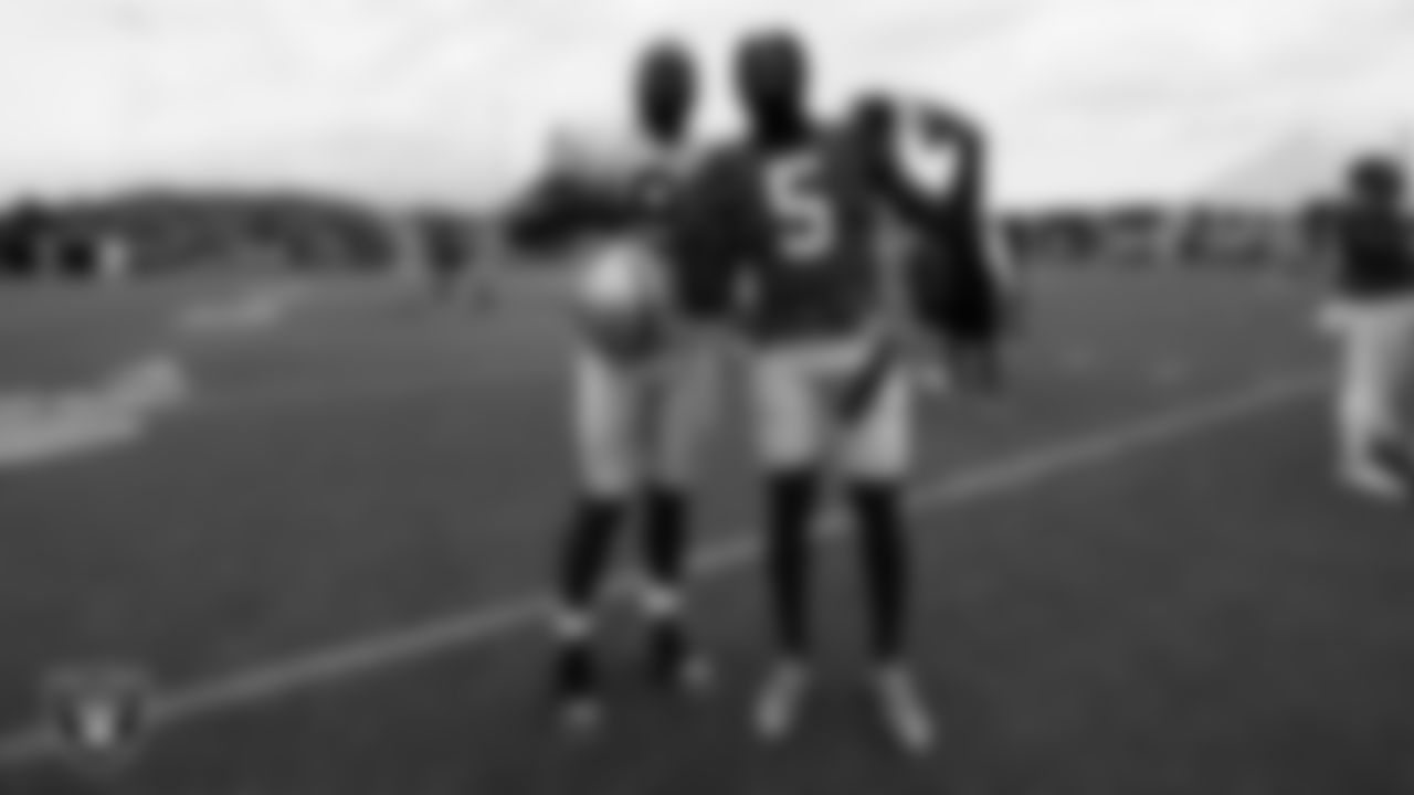 Las Vegas Raiders defensive end Yannick Ngakoue (91) with Los Angeles Rams cornerback Jalen Ramsey (5) on the field for a joint practice with the Los Angeles Rams at 2021 Training Camp.