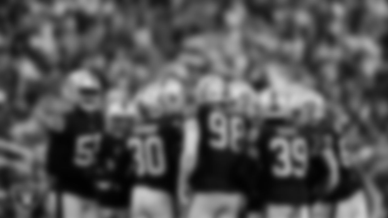 The Las Vegas Raiders defense huddle during the regular season home game against the New England Patriots at Allegiant Stadium.