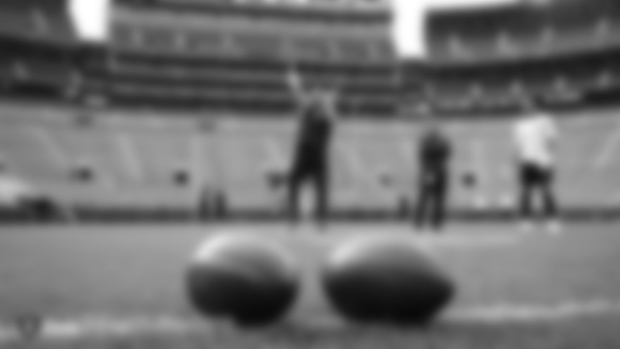 Raiders quarterback Derek Carr (4) warms up before the regular season game against the Green Bay Packers at Lambeau Field.