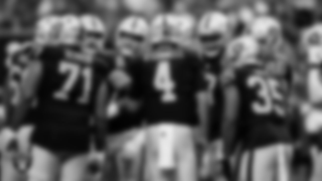 The Las Vegas Raiders huddle during the preseason home game against the San Francisco 49ers at Allegiant Stadium.