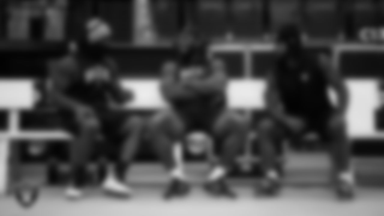 Las Vegas Raiders linebacker Denzel Perryman (52), running back Brandon Bolden (34) and running back Ameer Abdullah (22) on the bench before the preseason home game against the Minnesota Vikings at Allegiant Stadium.
