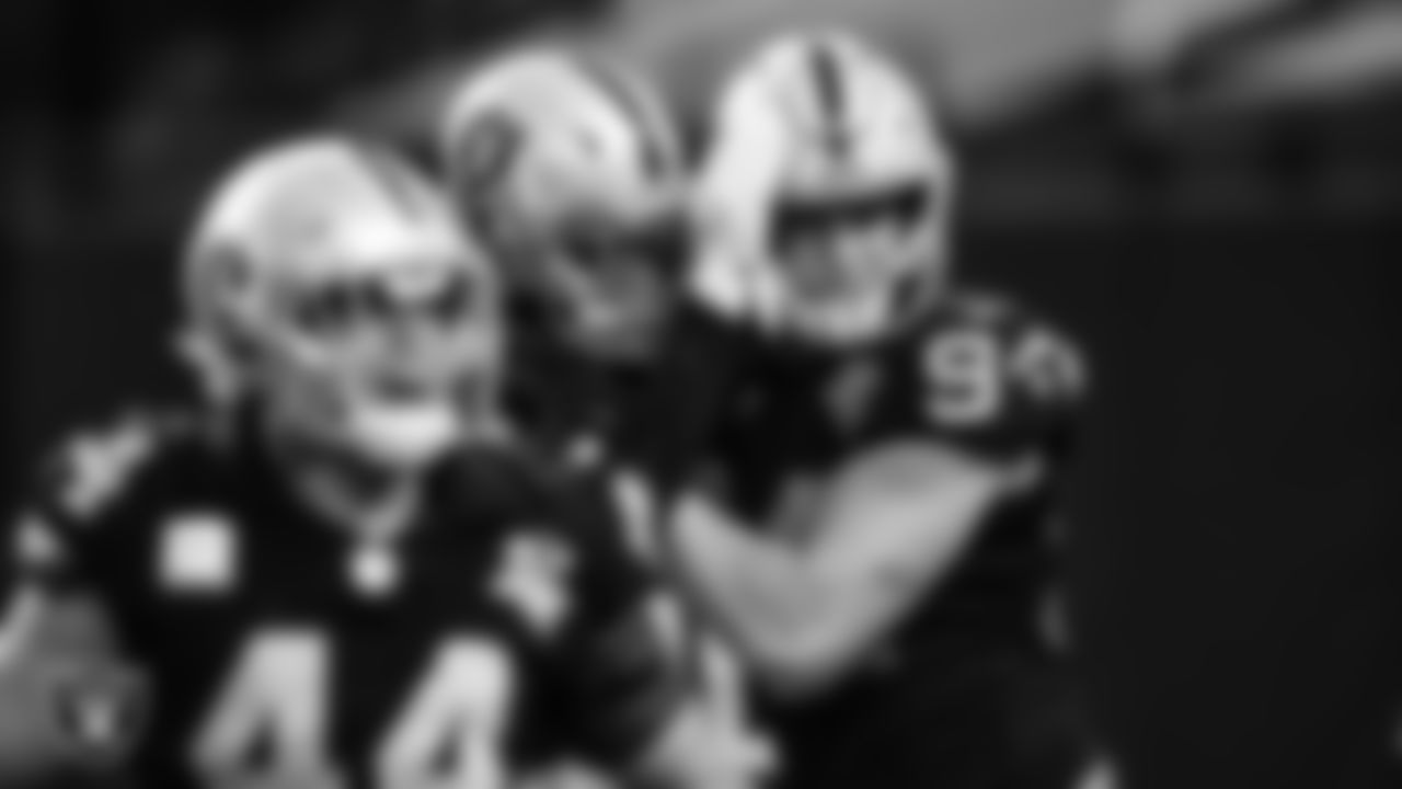 Las Vegas Raiders defensive end Carl Nassib (94) celebrates with defensive end Arden Key (99) after intercepting a pass during the regular season home game against the Denver Broncos.