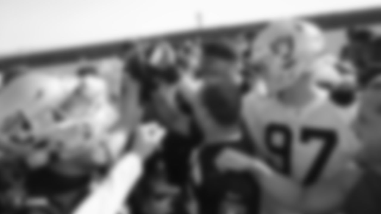 The Raiders huddle during practice.