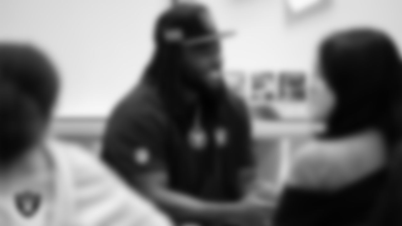 Las Vegas Raiders defensive lineman Adam Butler (69) talks to students during the Hip Hop Entrepreneurship Program Academy at Grant Sawyer Middle School.
