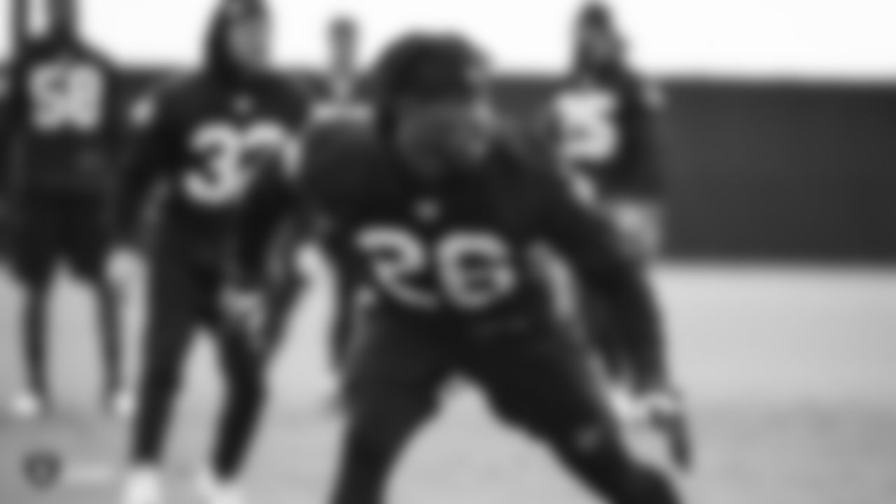 Raiders cornerback Nevin Lawson (26) goes through defensive drills during practice.