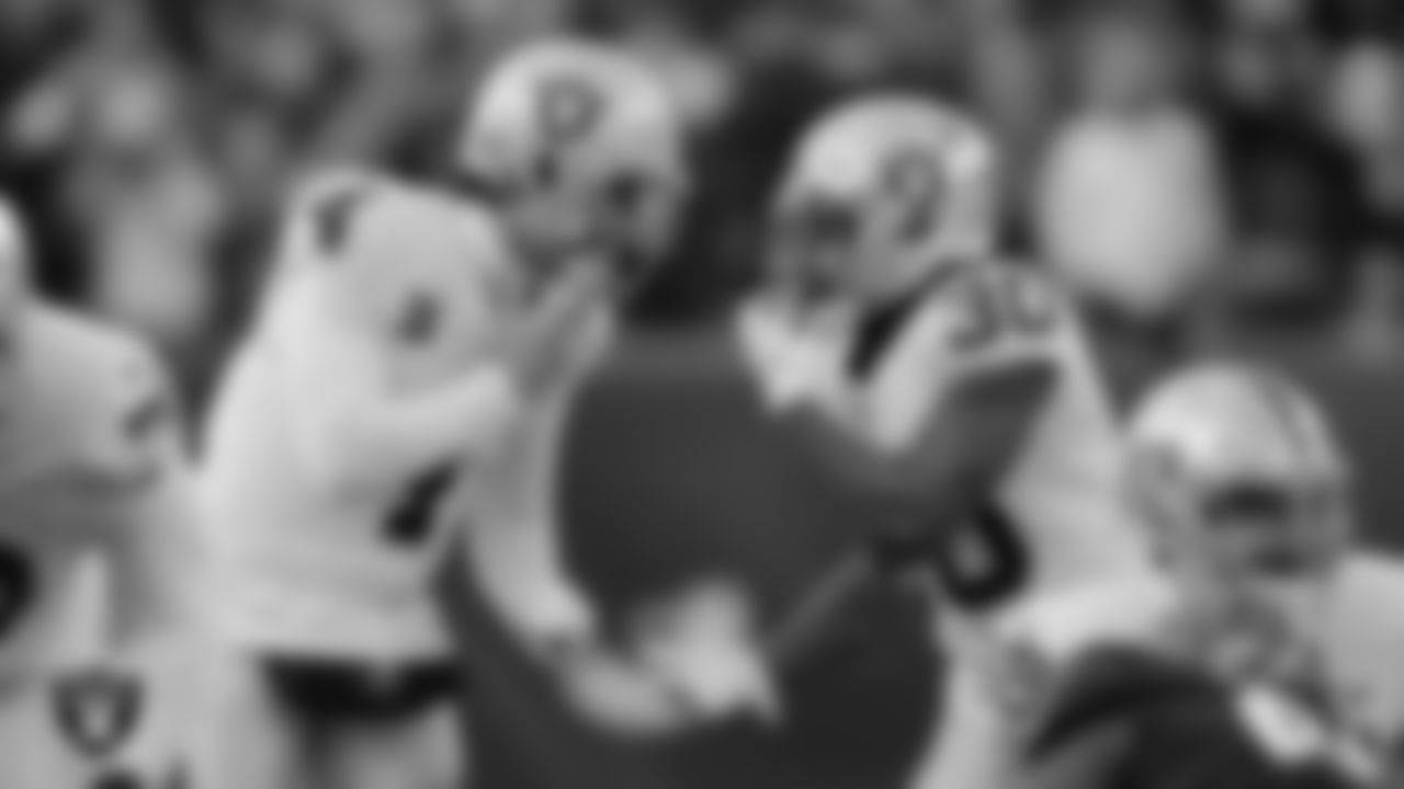 Las Vegas Raiders quarterback Derek Carr (4) and running back Jalen Richard (30) during the postseason away game against the Cincinnati Bengals.